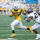 Justin Crawford of the West Virginia Mountaineers runs the ball against the Missouri Tigers in the first half of the game at Milan Puskar Stadium on Sept. 3, 2016 in Morgantown, West Virginia. West Virginia defeated Missouri 26-11.